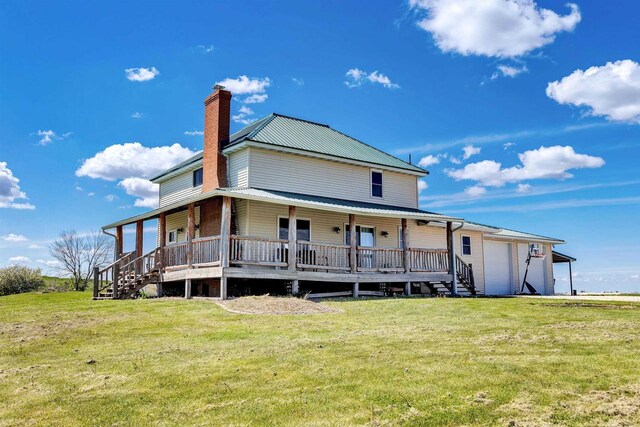 4600 Kamper Ln, Denmark, WI 54208 - back of property with covered porch, a chimney, and a yard