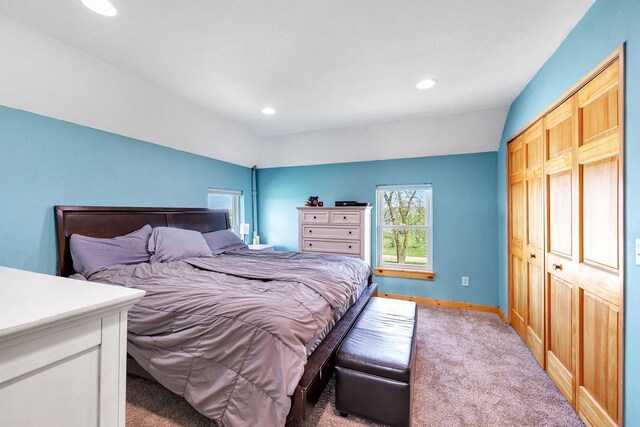 4600 Kamper Ln, Denmark, WI 54208 - bedroom with light colored carpet, baseboards, recessed lighting, vaulted ceiling, and a closet