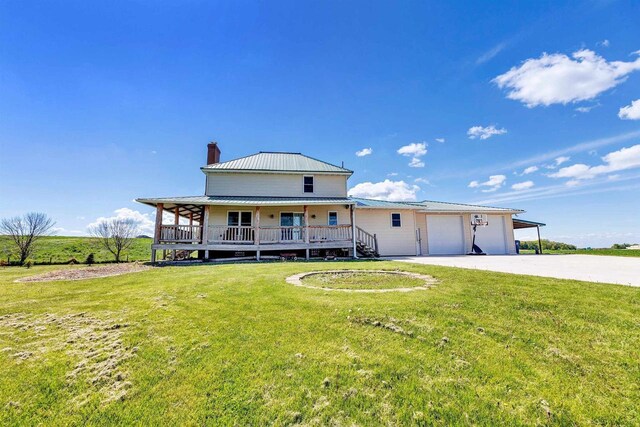 4600 Kamper Ln, Denmark, WI 54208 - view of front of property featuring a chimney, a porch, driveway, and a front lawn