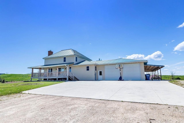 4600 Kamper Ln, Denmark, WI 54208 - view of front of property with driveway, covered porch, a chimney, an attached garage, and metal roof