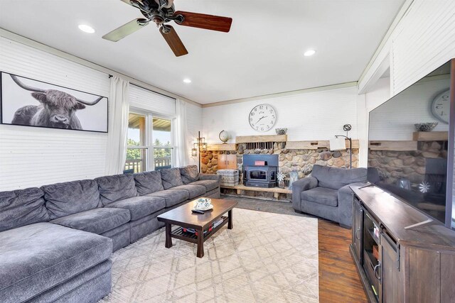 4600 Kamper Ln, Denmark, WI 54208 - living area featuring a wood stove, wood finished floors, ceiling fan, recessed lighting, and crown molding