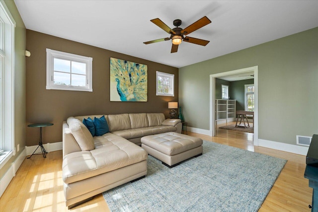 4320 High, Point Beach Lane, Port Washington, WI 53074 - living area featuring a ceiling fan, light wood-style flooring, and plenty of natural light