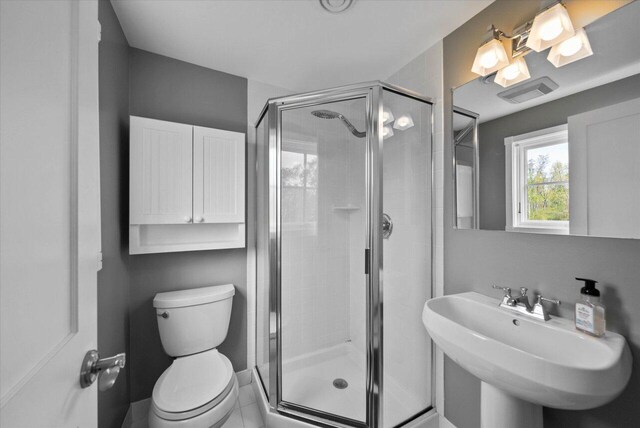 4320 High, Point Beach Lane, Port Washington, WI 53074 - full bathroom with toilet, a shower stall, and a sink