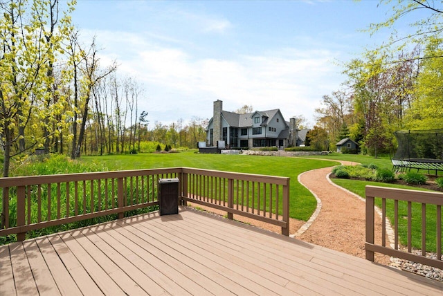 4320 High, Point Beach Lane, Port Washington, WI 53074 - wooden deck with a trampoline and a lawn
