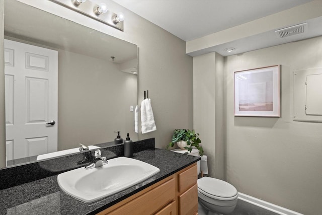 270 E Highland Ave Unit 1031, Milwaukee, WI 53202 - bathroom with vanity, toilet, and baseboards