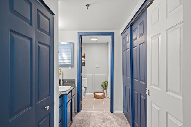 270 E Highland Ave Unit 1031, Milwaukee, WI 53202 - bathroom featuring toilet, a closet, tile patterned floors, and vanity