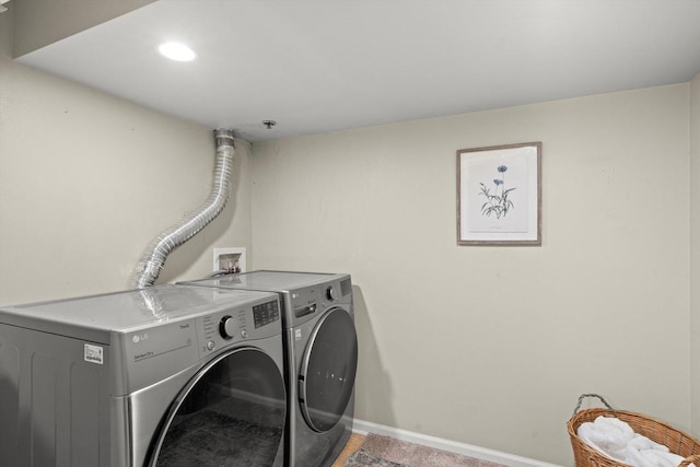 270 E Highland Ave Unit 1031, Milwaukee, WI 53202 - laundry area featuring washer and dryer and baseboards