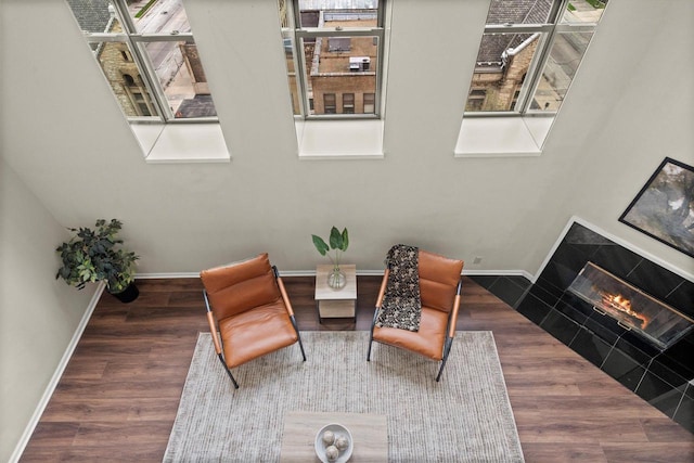 270 E Highland Ave Unit 1031, Milwaukee, WI 53202 - sitting room featuring baseboards, wood finished floors, and a glass covered fireplace