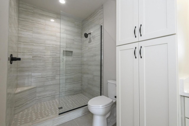 20840 Gray St, Lannon, WI 53046 - bathroom featuring toilet, a tile shower, tile patterned flooring, and recessed lighting