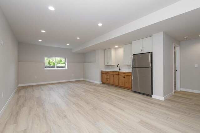 20840 Gray St, Lannon, WI 53046 - kitchen with freestanding refrigerator, a sink, light wood-style flooring, baseboards, and recessed lighting