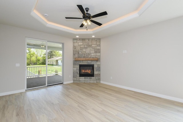 20840 Gray St, Lannon, WI 53046 - unfurnished living room with a raised ceiling, wood finished floors, a ceiling fan, and baseboards