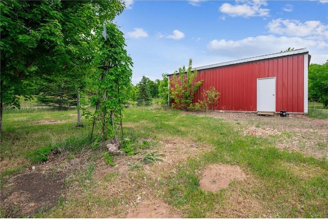 2077A 250th Ave Unit N, Luck, WI 54853 - view of yard featuring a pole building and an outdoor structure