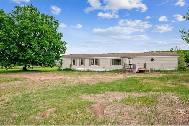 2077A 250th Ave Unit N, Luck, WI 54853 - back of house with a wooden deck and a yard