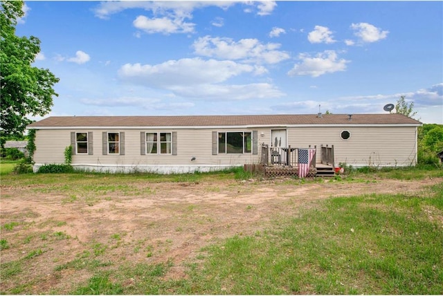 2077A 250th Ave Unit N, Luck, WI 54853 - rear view of house with a wooden deck