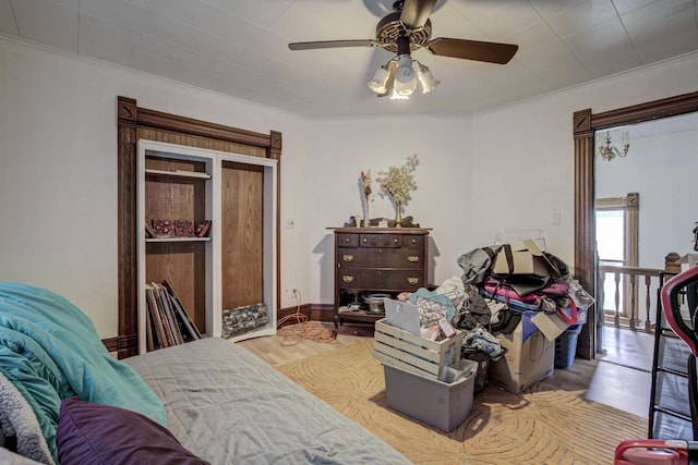 535 Jackson St, Oshkosh, WI 54901 - bedroom with wood finished floors, ornamental molding, and ceiling fan
