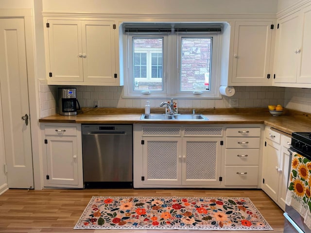 620 W Rock Pl, Glendale, WI 53209 - kitchen with appliances with stainless steel finishes, a sink, light wood finished floors, and white cabinets