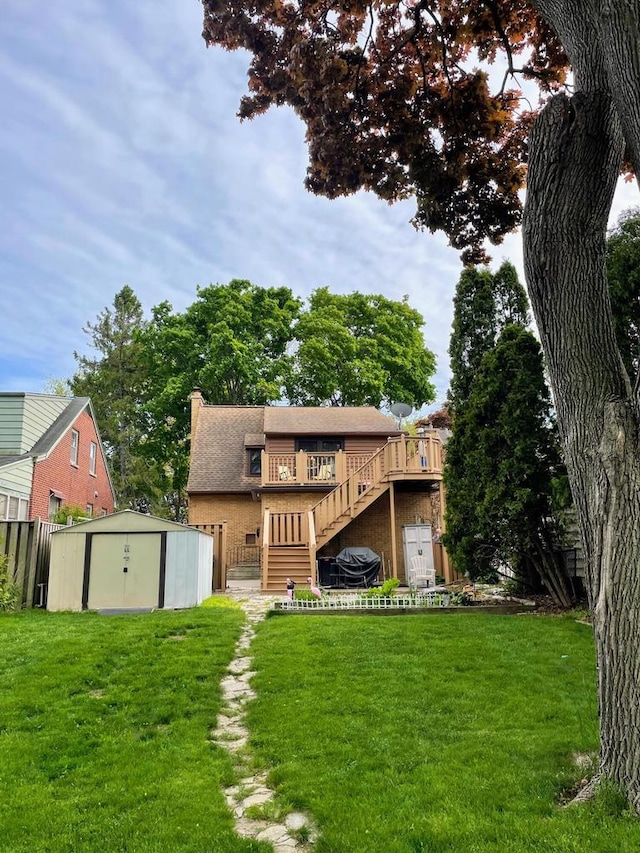 620 W Rock Pl, Glendale, WI 53209 - back of property with stairway, a deck, a yard, and a chimney