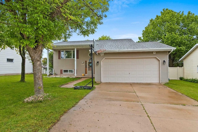 1330 Pinehurst Ln, Neenah, WI 54956 - tri-level home featuring a garage, driveway, and a shingled roof