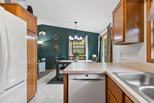 1330 Pinehurst Ln, Neenah, WI 54956 - kitchen with white appliances, vaulted ceiling, brown cabinetry, light floors, and a textured ceiling