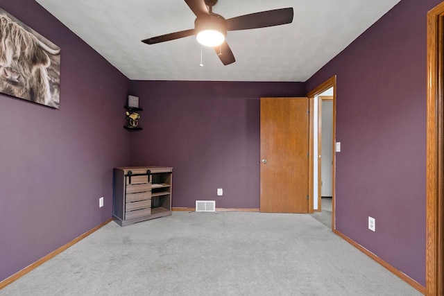 1330 Pinehurst Ln, Neenah, WI 54956 - unfurnished bedroom with carpet floors, baseboards, and ceiling fan
