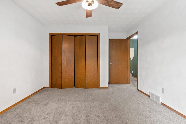 1330 Pinehurst Ln, Neenah, WI 54956 - unfurnished bedroom featuring carpet flooring, baseboards, a closet, and a ceiling fan