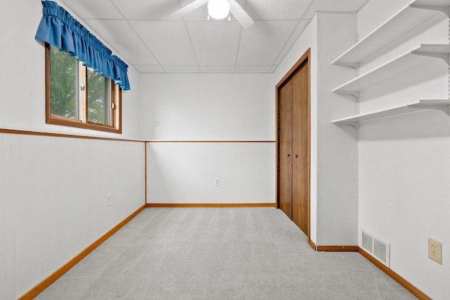1330 Pinehurst Ln, Neenah, WI 54956 - unfurnished bedroom featuring a drop ceiling, carpet, baseboards, and a ceiling fan