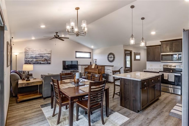 16437 56th Ave, Chippewa Falls, WI 54729 - dining room featuring ceiling fan, light wood-style flooring, vaulted ceiling, a chandelier, and recessed lighting