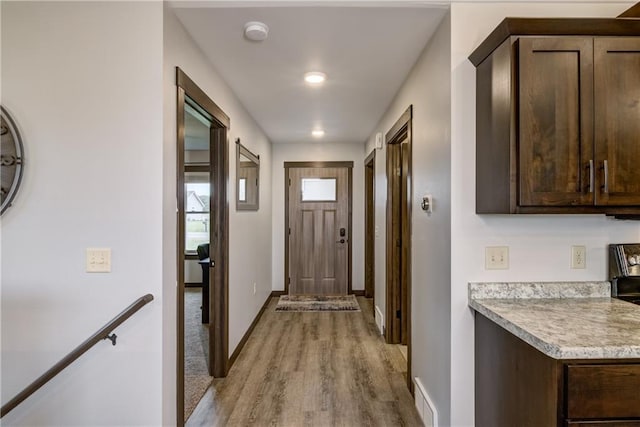 16437 56th Ave, Chippewa Falls, WI 54729 - doorway to outside with light wood-style flooring and baseboards