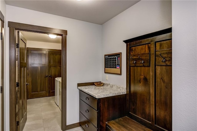 16437 56th Ave, Chippewa Falls, WI 54729 - mudroom with independent washer and dryer, baseboards, and light tile patterned floors