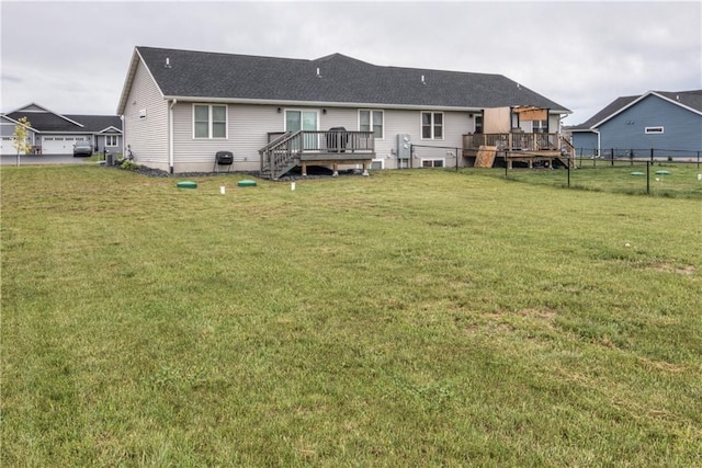 16437 56th Ave, Chippewa Falls, WI 54729 - rear view of house with a deck and roof with shingles