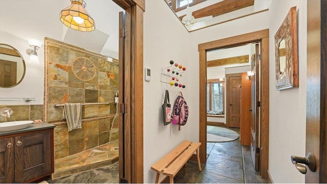 N30732 Square Bluff Rd, Blair, WI 54616 - hall featuring stone tile flooring, a sink, and baseboards