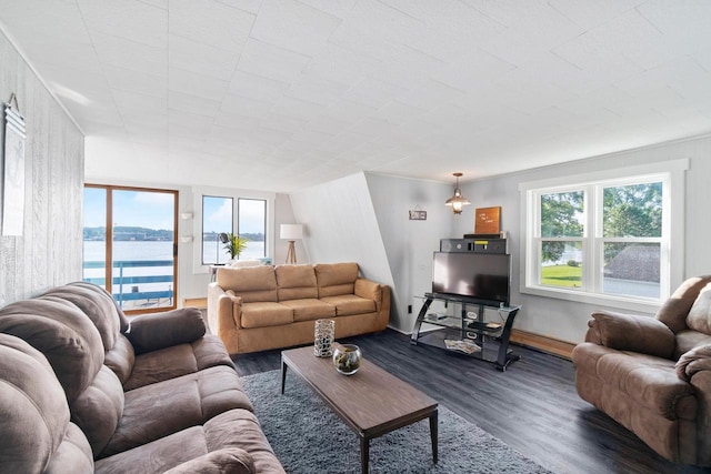 440 N Hudson Ave, Sturgeon Bay, WI 54235 - living area featuring dark wood-style flooring, a baseboard heating unit, and a water view
