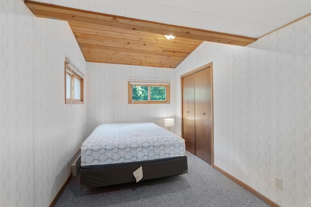 440 N Hudson Ave, Sturgeon Bay, WI 54235 - bedroom featuring wallpapered walls, carpet floors, lofted ceiling, wooden ceiling, and baseboards