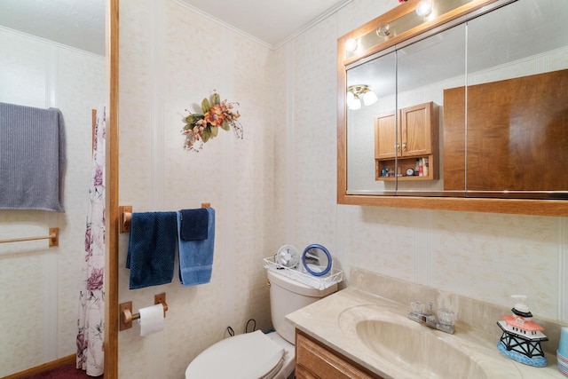 440 N Hudson Ave, Sturgeon Bay, WI 54235 - bathroom with vanity, wallpapered walls, crown molding, and toilet