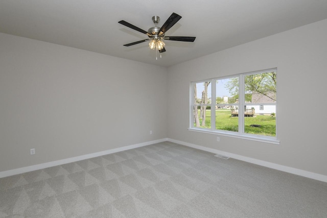 20880 Gray St, Lannon, WI 53046 - empty room with baseboards, light colored carpet, and a ceiling fan