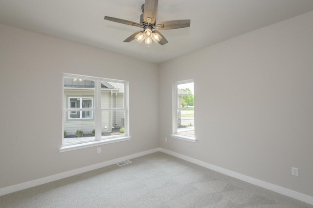 20880 Gray St, Lannon, WI 53046 - unfurnished room with baseboards, light colored carpet, and ceiling fan