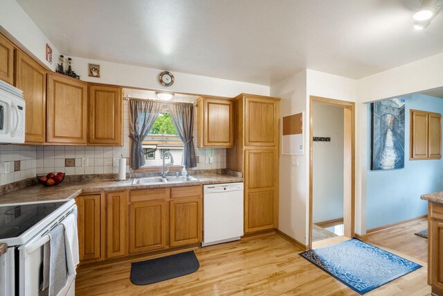 17120 W Fullerton Ave, New Berlin, WI 53151 - kitchen with white appliances, a sink, decorative backsplash, light wood-type flooring, and baseboards