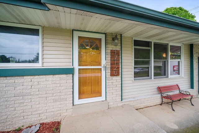 17120 W Fullerton Ave, New Berlin, WI 53151 - property entrance featuring covered porch and brick siding