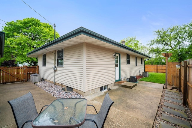17120 W Fullerton Ave, New Berlin, WI 53151 - back of property featuring a patio area, a fenced backyard, and central AC unit