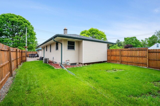17120 W Fullerton Ave, New Berlin, WI 53151 - rear view of house with a chimney, cooling unit, and a patio area