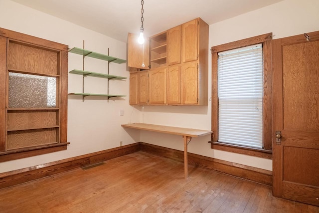 305 N 1st St, Colby, WI 54421 - unfurnished office with hardwood / wood-style flooring, built in study area, and baseboards