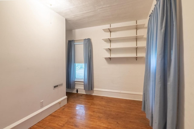 305 N 1st St, Colby, WI 54421 - unfurnished room with wood finished floors and baseboards
