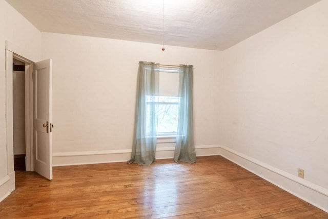 305 N 1st St, Colby, WI 54421 - empty room featuring hardwood / wood-style flooring and baseboards