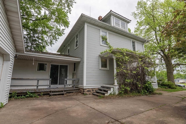 305 N 1st St, Colby, WI 54421 - rear view of house featuring a chimney