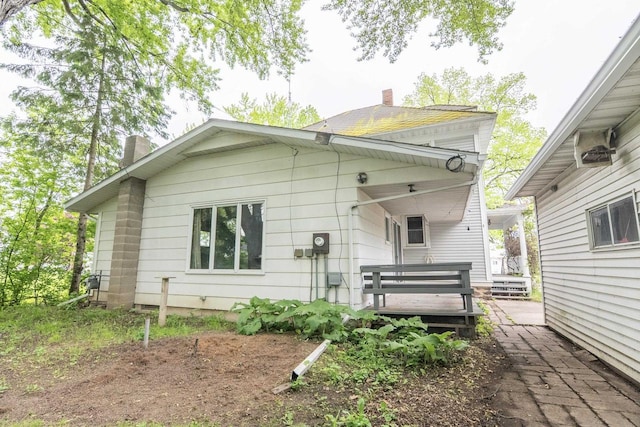 305 N 1st St, Colby, WI 54421 - rear view of property with a chimney