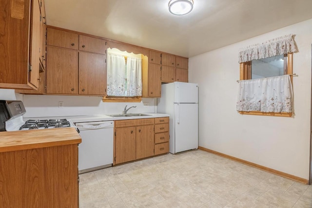 305 N 1st St, Colby, WI 54421 - kitchen featuring white appliances, a sink, baseboards, and wooden counters