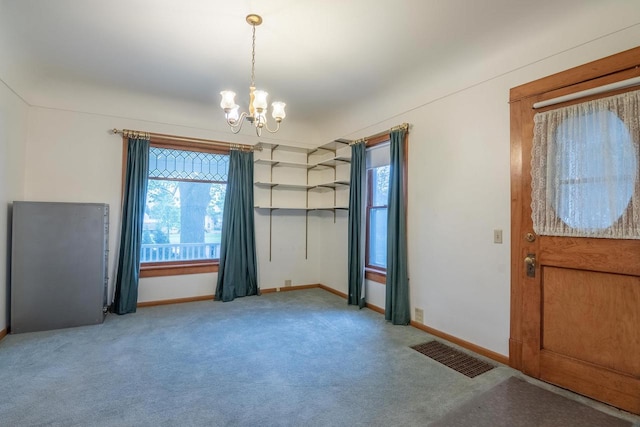 305 N 1st St, Colby, WI 54421 - foyer featuring a chandelier, carpet floors, and baseboards