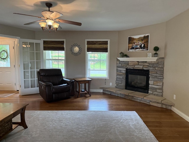 121 Doc Mac Dr, Boscobel, WI 53805 - living area with wood finished floors, a ceiling fan, baseboards, and a fireplace