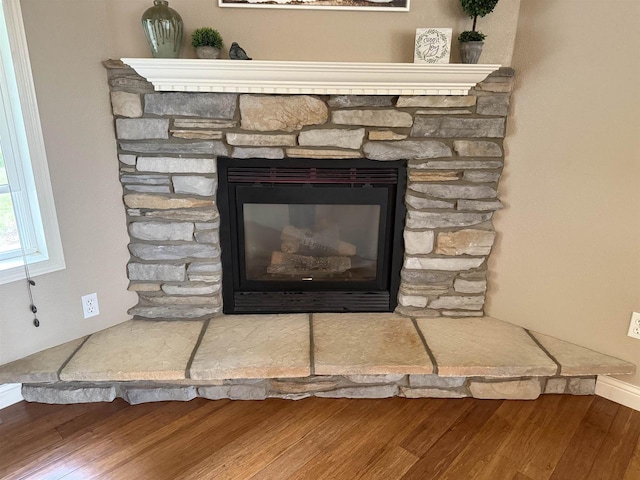 121 Doc Mac Dr, Boscobel, WI 53805 - detailed view of wood finished floors, a fireplace, and baseboards