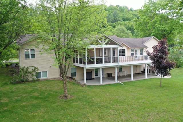 121 Doc Mac Dr, Boscobel, WI 53805 - back of property featuring a patio, a lawn, and a sunroom
